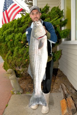 Arden Gardell with a 26 pound striped bass. Paulie's Tackle of Montauk