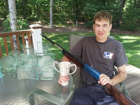 East Hampton's Mathew Griffths with his first place trophy from the Northeast Regional Sporting Clays Championship last month in Pennsylvania