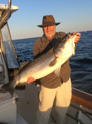 Terry O'Riordan caught this 34-pound striped bass off Montauk aboard the Capt. Ron charter boat last week on one of Capt. Ron's homemade butterfish jigs. Capt. Ron Oronato