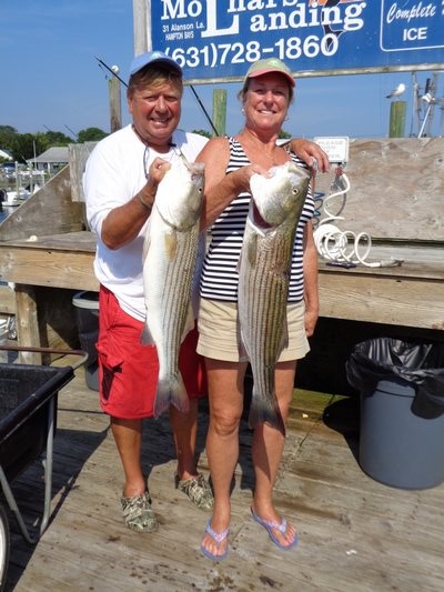 Marty and Helen Zoltowski with stripers caught in Shinnecock Bay aboard Aqua Mama. 