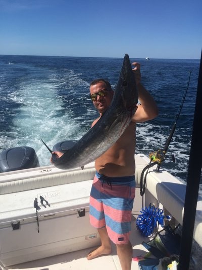 Marek Janota shows off the wahoo he caught while fishing with Jeff Yokavonis just 16 miles south of Montauk.