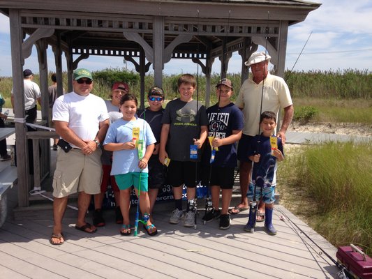 Winners of the Southampton Town snapper derby last weekend collected their prizes from Parks and Recreation Superintendent Chris Bean and Town Trustee Scott Horowitz.