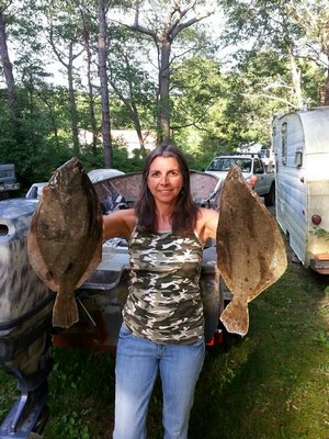 Ramona Gallo with a pair of big fluke she picked out of Western Shinnecock Bay this summer. Franbo