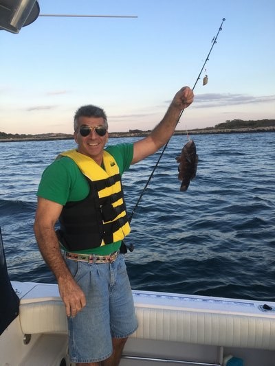 Chris Virga shows off a whopper of a blackfish he caught near Fishers Island last week. It was not the biggest of the day