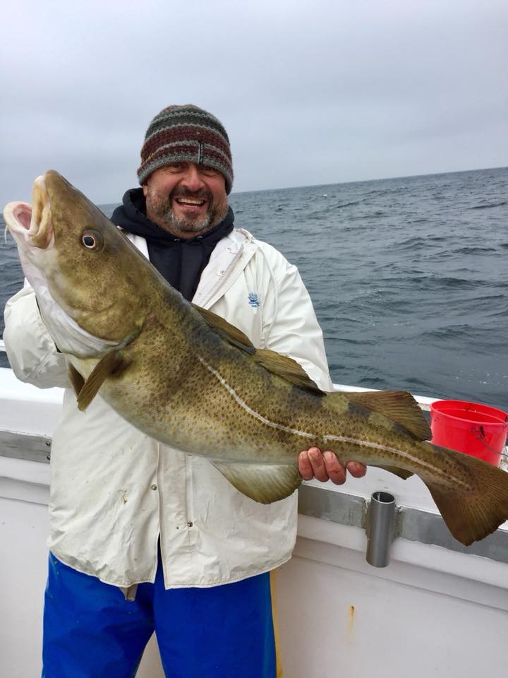 The fish feast on Christmas Eve will be robust at Nader Gebrin's house thanks to this fat cod he caught recently aboard the Hampton Lady. Capt. Jim Foley