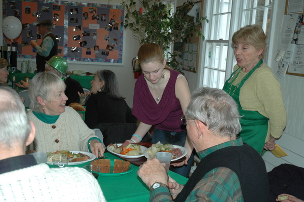   work in the kitchen at the Springs Community Presbyterian Church's St. Patrick Day corned beef and cabbage dinner.