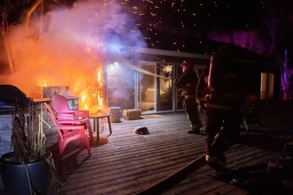 Members of the East Hampton Fire Department extinguished a fire on the deck of a residence at 123 Accabonac Road