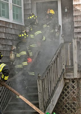 A hose team prepares to enter a soon to be demolished home during a joint drill between the Quogue and Westhampton Beach fire deparments. COURTESY WESTHAMPTON BEACH FIRE DEPARTMENT