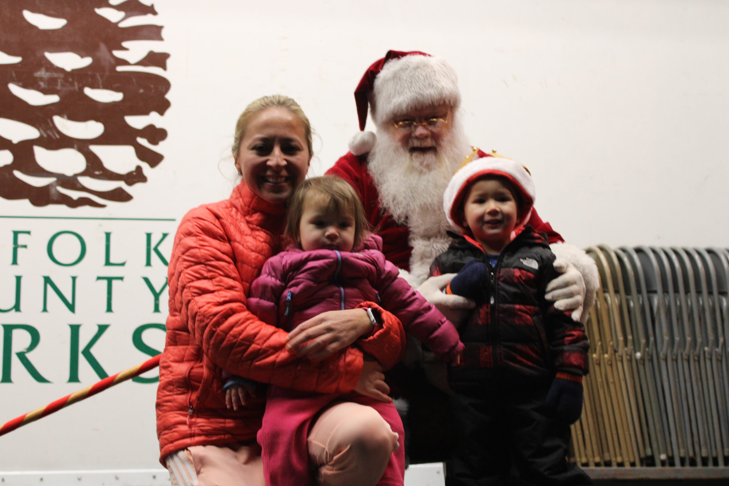 Viviana Smith and her children Bryce and Sofia metting Santa.  