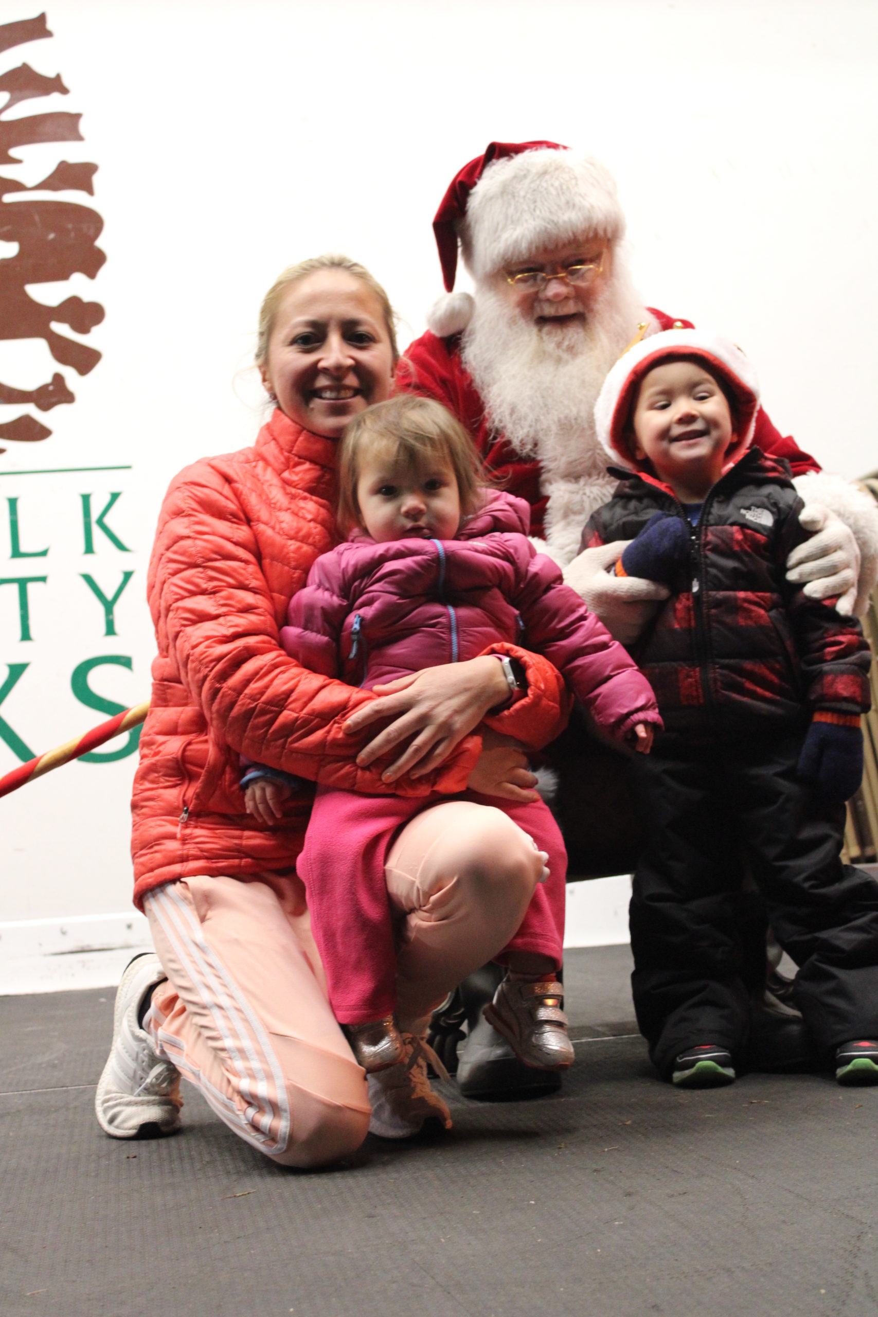 Viviana Smith and her children Bryce and Sofia metting Santa. 