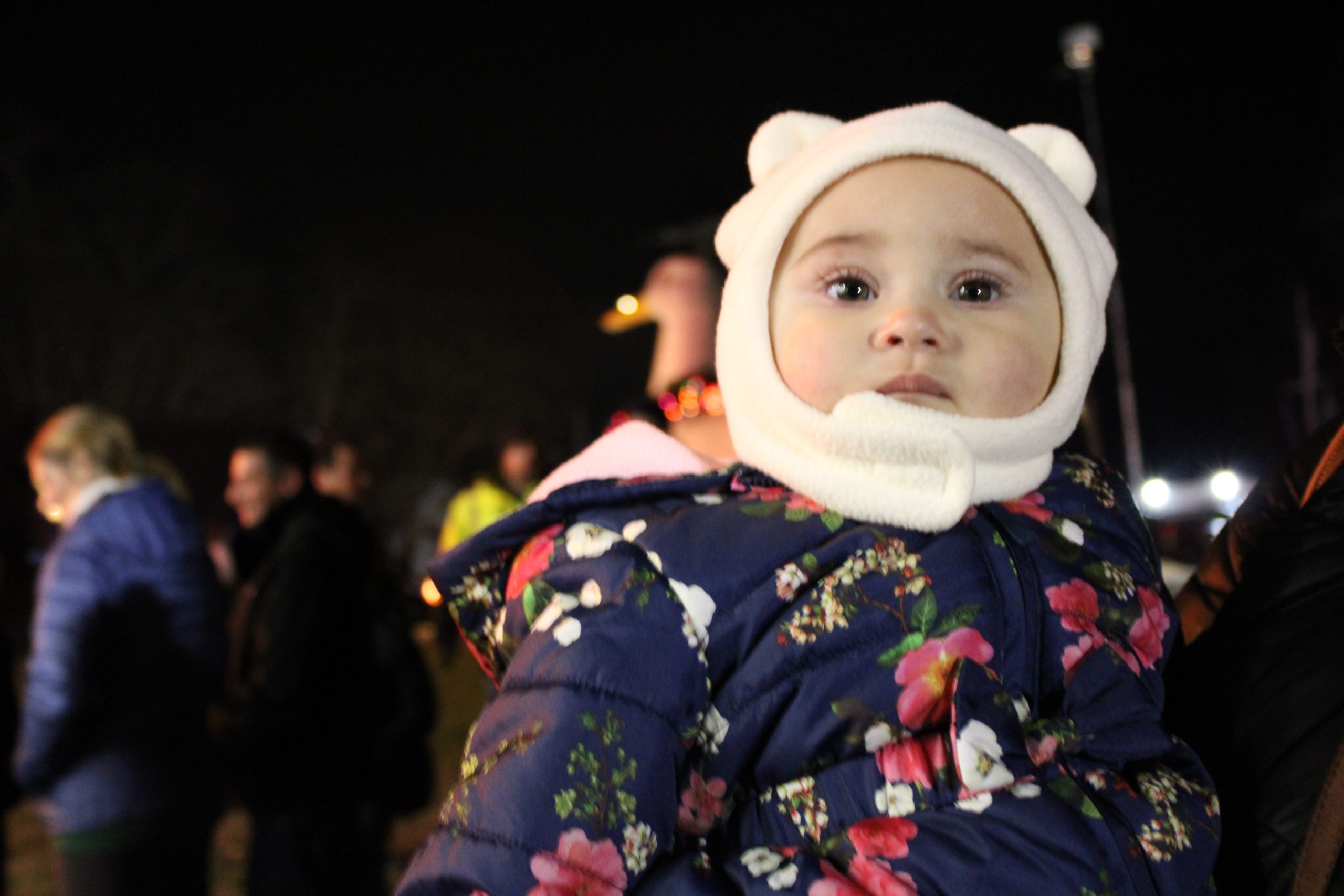 Eliana Valderrama watching Santa on stage. 