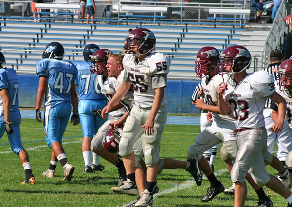 Kelly Kalbacher congratulating Rob Greene after his touchdown run against Rocky Point.
