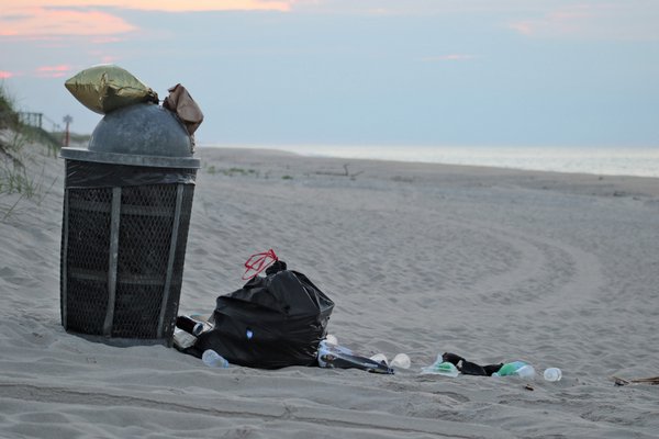 An overflowing trash can at a local beach. COURTESY DELL CULLUM