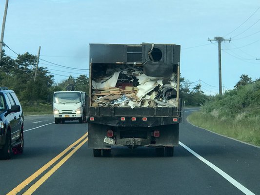 A trash truck on Napeague in June.    COURTESY DELL CULLUM