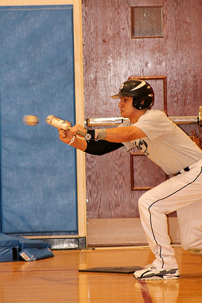 ESM's Mike Shine lays down a bunt in practice last week. KERRY MONACO