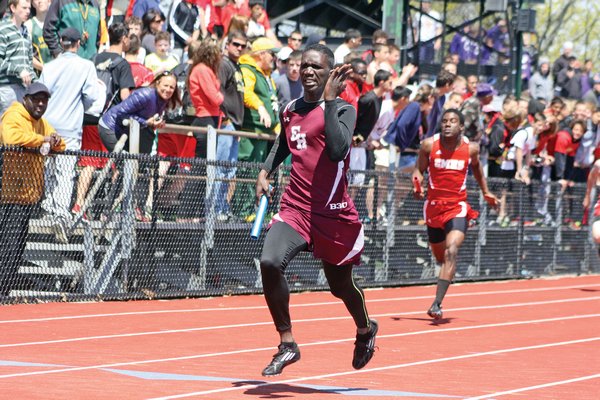 East Hampton's Wanya Reid finishes off the 4x100-meter relay at the Westhampton Beach Invitational. By CAILIN RILEY
