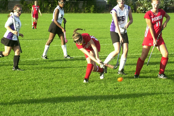 Alexa Lantiere takes a shot as teammate Aly Bori looks on. <br>Photo by Cailin Riley