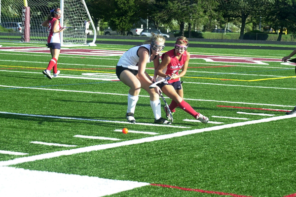 Briana Frasher battles a Miller Place defender.<br>Photo by Cailin Riley