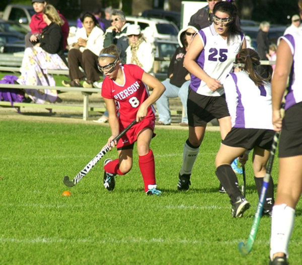 Kacey Gilbride looks to pass.<br>Photo by Cailin Riley