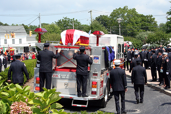  of Eastport attended his wake at Sinnickson's Funeral Home in Center Moriches on Monday. Mr. Warhola died from an apparent stroke on Friday after responding to a fire alarm in Brooklyn.