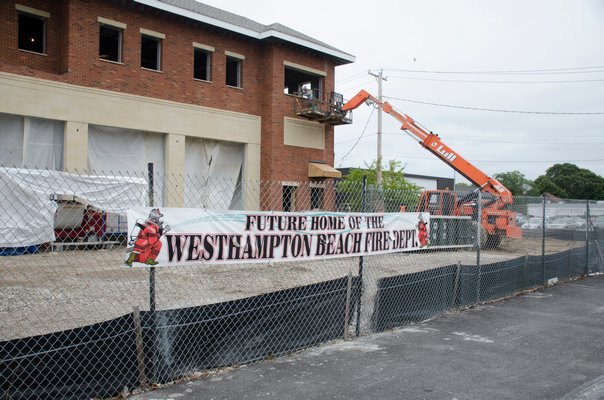 Construction crews work on the the new Westhampton Beach firehouse that is located on Sunset Avenue. GREG WEHNER