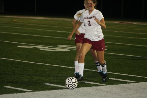  and Sarah Warren put pressure on a Pierson player in Southampton's 1-0 homecoming win. CAILIN RILEY