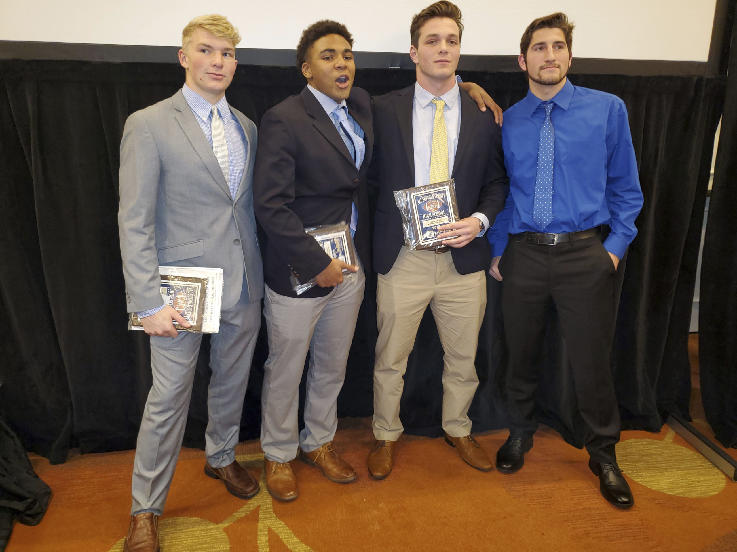 It was a big night for the Hurricanes at the Suffolk County Awards Dinner at the Hyatt Regency in Hauppauge on Monday night. From left to right, head coach Bryan Schaumloffel, Shavar Coffey, Jaden AlfanoStJohn, Jesse AlfanoStJohn, Chris Daleo, Devin Koonmen and assistant coach Cole Magner.