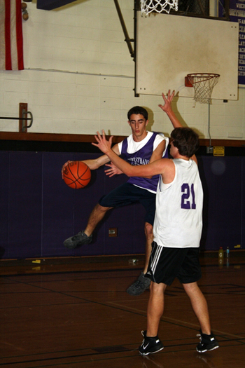 Andre Assis tries to send a pass around Ryan Walker. 