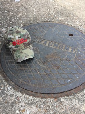 A Team Rubicon hat representing the organization's help with cleaning out houses in Beaumont