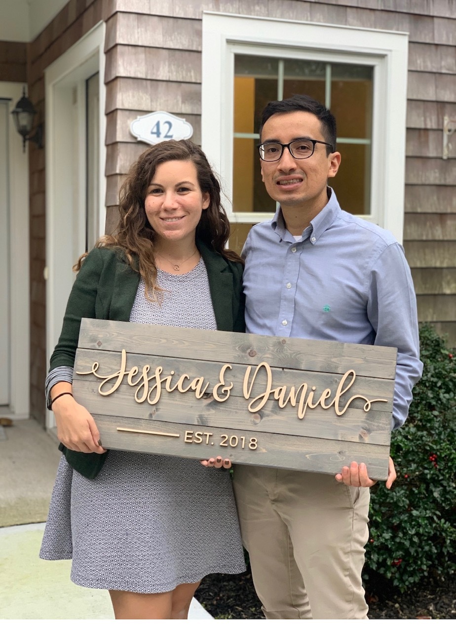 Jessica and Daniel Gomez in front of their new home. 