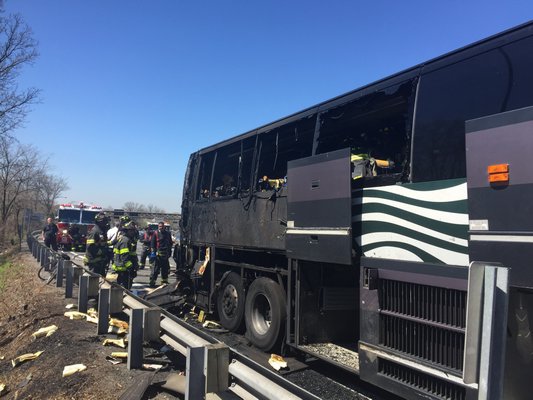A Hampton Jitney bus burns on the Long Island Expressway on Saturday morning. Member Submitted