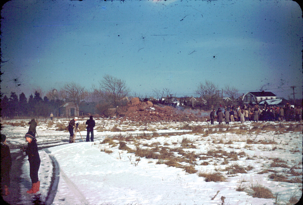 A crowd examines the debris after the Shinnecock Lighthouse was demolished on December 23