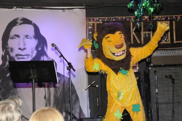 An unknown contestant dances in a lion costume. RICHARD LEWIN