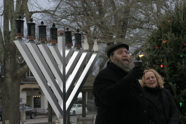 Rabbi Leibel Baumgarten at the lighting of the menorah in Herrick Park on Sunday. MICHAEL WRIGHT