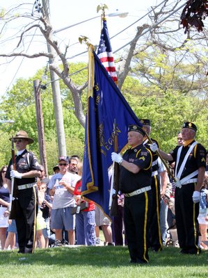 Members of the East Quogue Fire Department march in its annual M