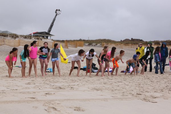 Members of the Peconic Ballet Theater pose for a photo at the 2nd annual Backpacks For Fellow Students Spring Splash at Rogers Beach on Saturday