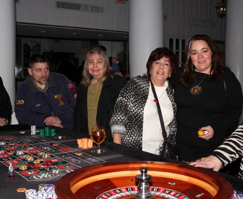 Phillip and Susan Tortorice with Catherine Tilotta and Christine Lamprecht at the Westhampton Kiwanis ‘Casino for a Cause” at Ocean Resort at Bath and Tennis on Saturday night. Neil Salvaggio