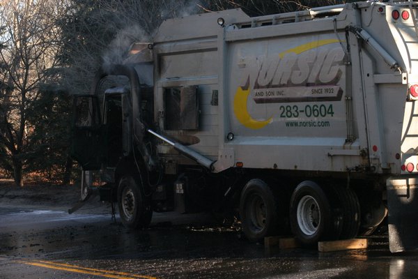 The Southampton Fire Department put out a fire that engulfed a garbage truck on Sandy Hollow Road on Monday morning. M. Wright