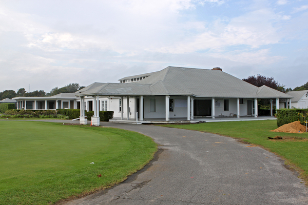 Members of the Quogue Field Club watch crews demolish their beloved clubhouse on Thursday