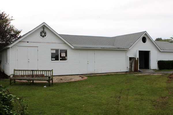 Members of the Quogue Field Club watch crews demolish their beloved clubhouse on Thursday