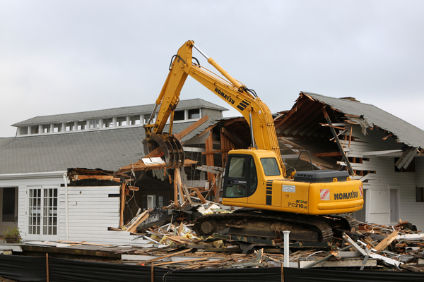 Members of the Quogue Field Club watch crews demolish their beloved clubhouse on Tuesday