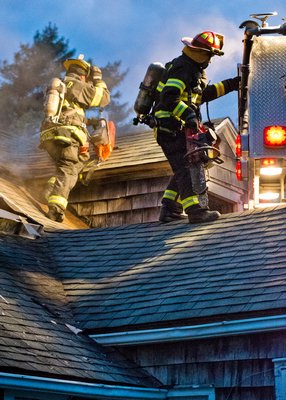 Westhampton Beach Fire Department Lieutenant Joey Gordon venting the roof. COURTESY WESTHAMPTON BEACH FIRE DEPARTMENT