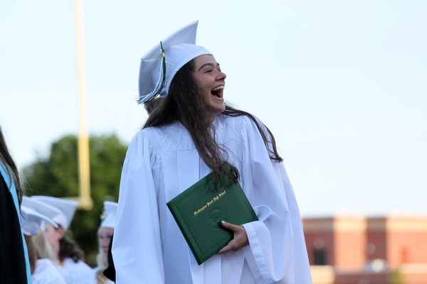  Emily Beaver and Emma Galasso lead the pledge of allegiance at the Westhampton Beach High School class of 2015 graduation ceremony. Neil Salvaggio