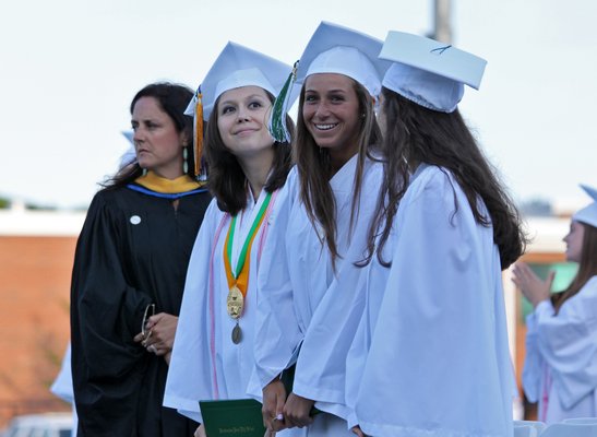 Senior members of the Chamber Singers perform the Star Spangled Banner at the Westhampton Beach High School class of 2015 graduation ceremony on Friday