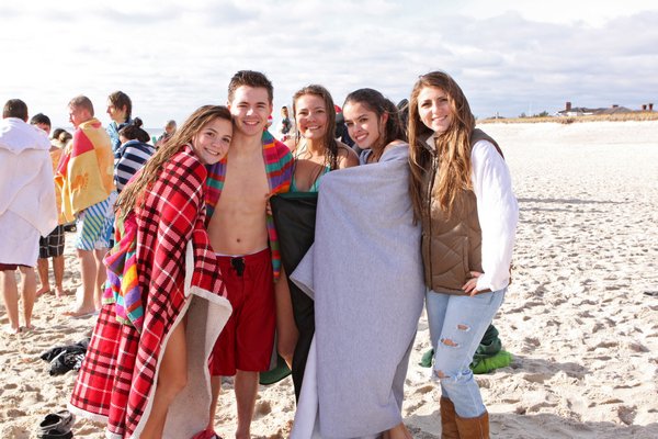 Katie Sorady and Jessica Lillie after the  Westhampton Beach High School Student Government's Polar Bear Plunge on Saturday morning at Rogers Beach. NEIL SALVAGGIO