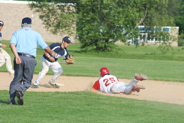 ESM senior Anthony Annunziata receives a throw from catcher Sean Doyle and tags out a Hills West player trying to steal second base.    DREW BUDD