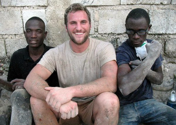 Hampton Bays resident Spencer Thorp works with Haitian natives on building a school in Haiti earlier this month. COURTESY SPENCER THORP