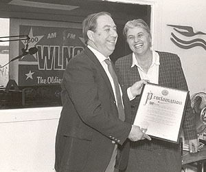 Paul Sidney receives a proclamation in 1989 from Southampton town Supervisor Mardythe DiPirro.