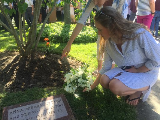 A tree and plaque in front of CVS on Pantigo Road in East Hampton Village were dedicated to Anna Mirabai Lytton on Wednesday. JAIME ZAHL