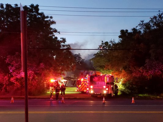 A fire engulfed a small shed on a residential property adjacent to Poxybogue Golf Center in Sagaponack on Saturday evening.  Ed Hoyt/Christine Hoyt